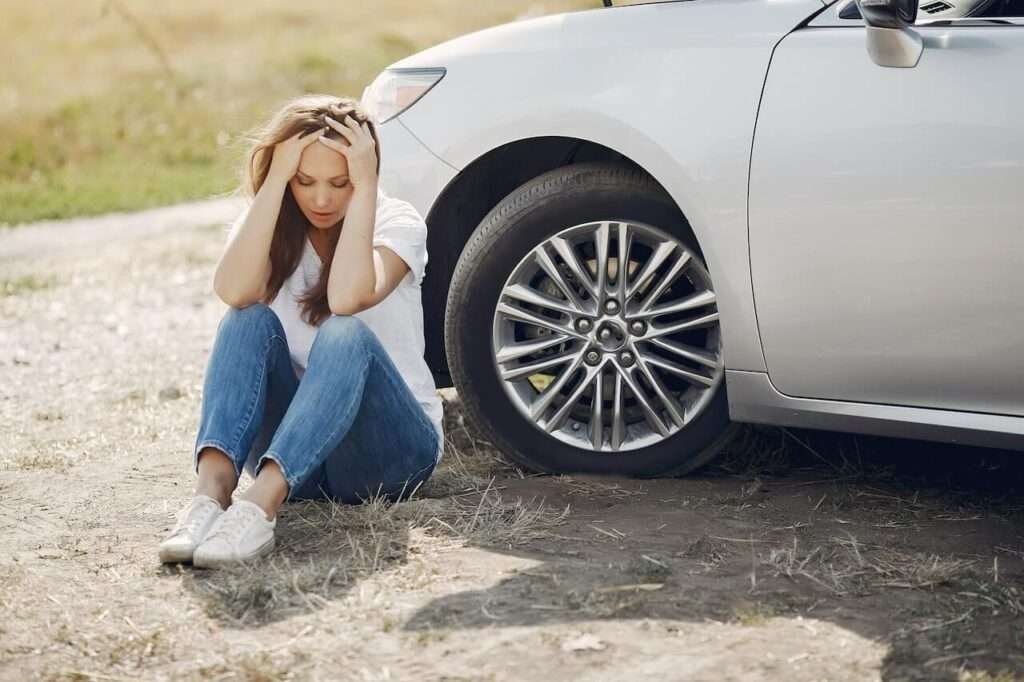 Girl down
car
ground
