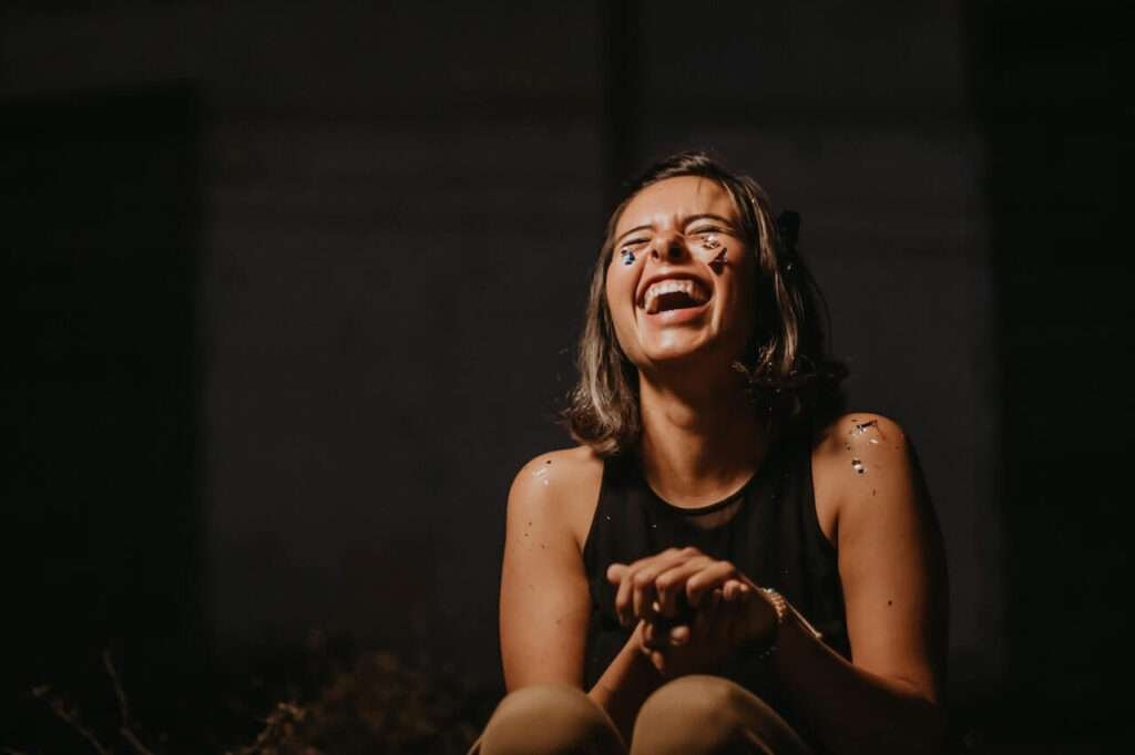 laughter girl
laughing girl
dark background