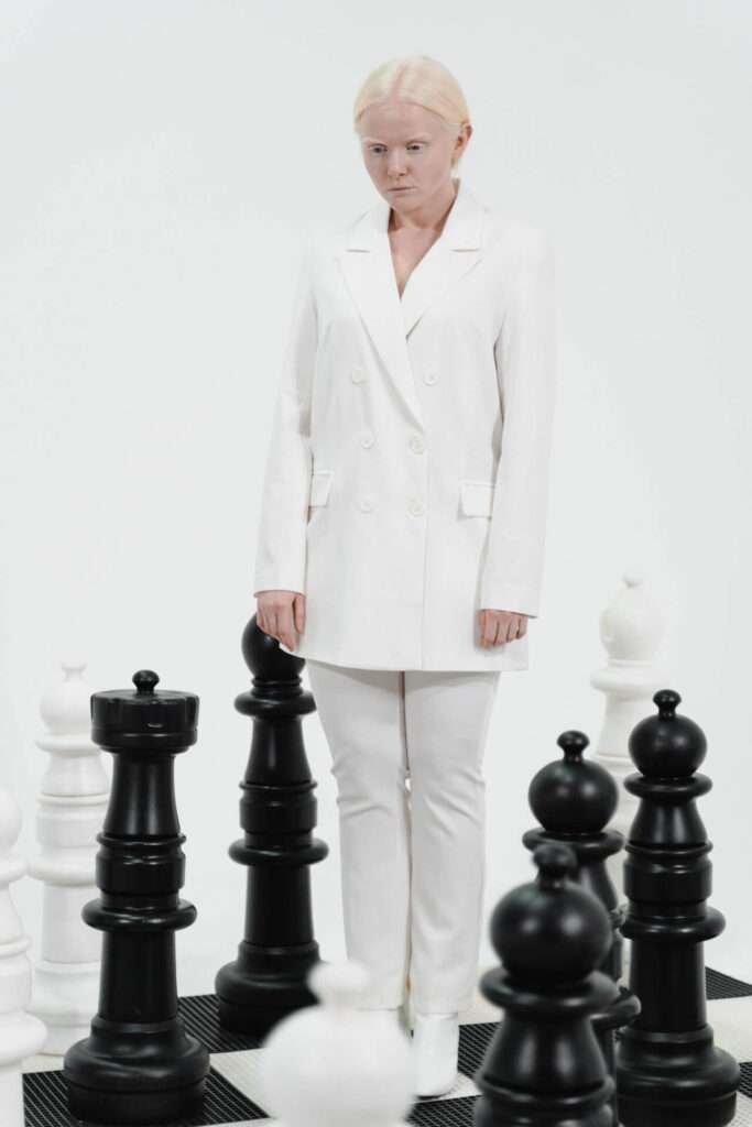 standing women 
black and white 
chess bord

